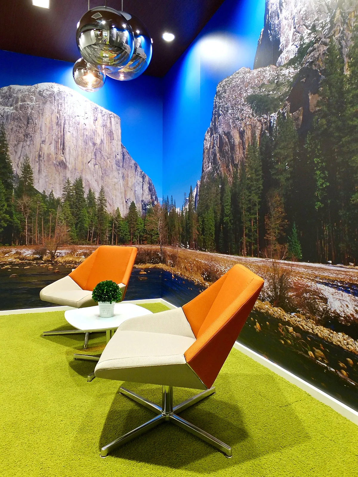 An outdoor-inspired modern office lounge designed by KARDENT tenant improvement services.
